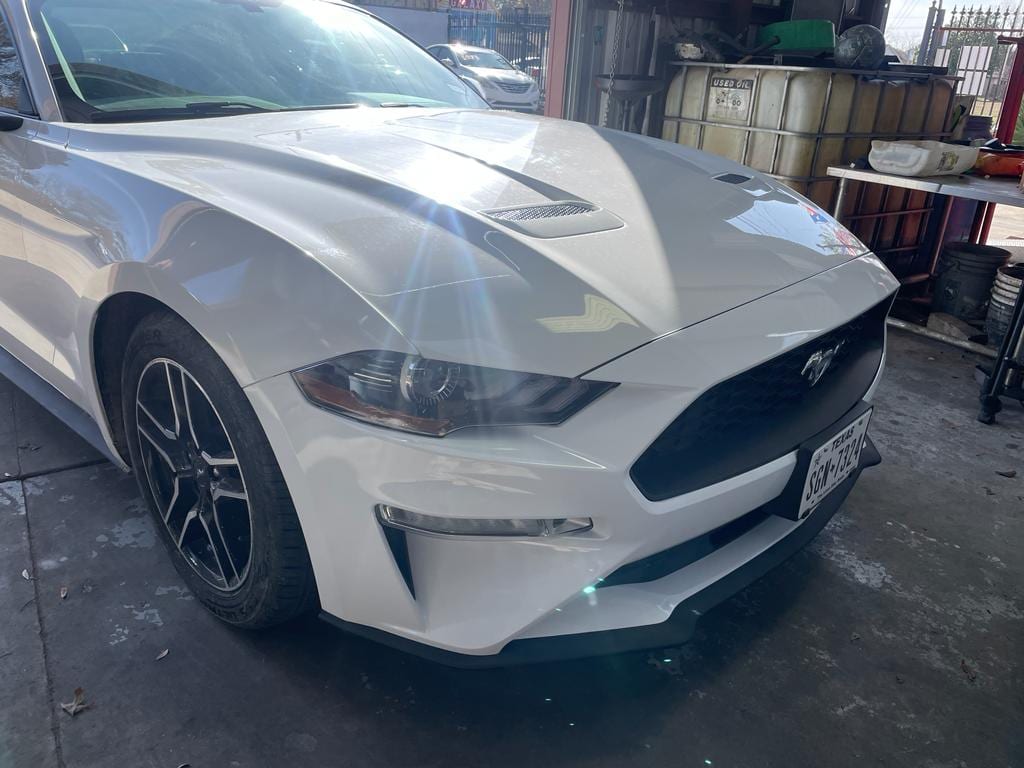 White Ford Mustang after bodywork, from Sam Auto Repair & Collision’s project photos