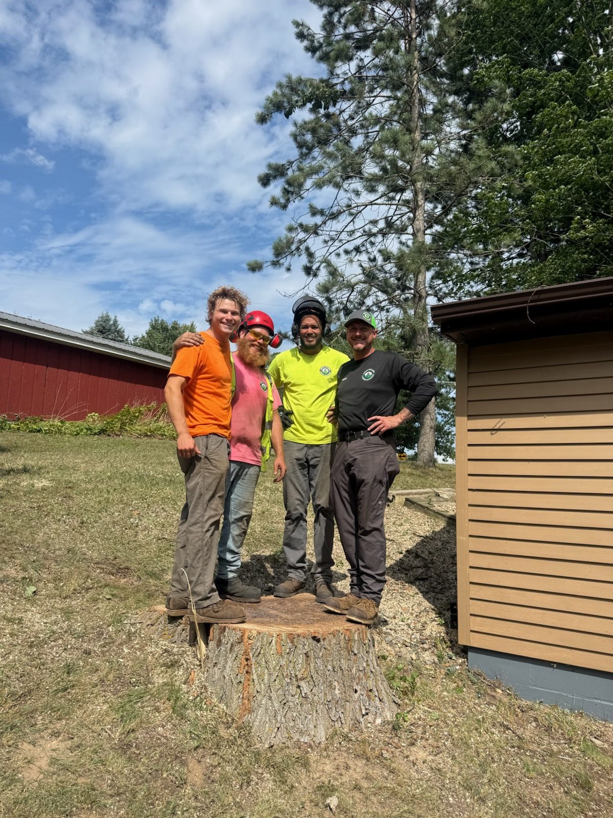 Josh Tullar and the Absolute Tree Service crew on a job site in Muskegon