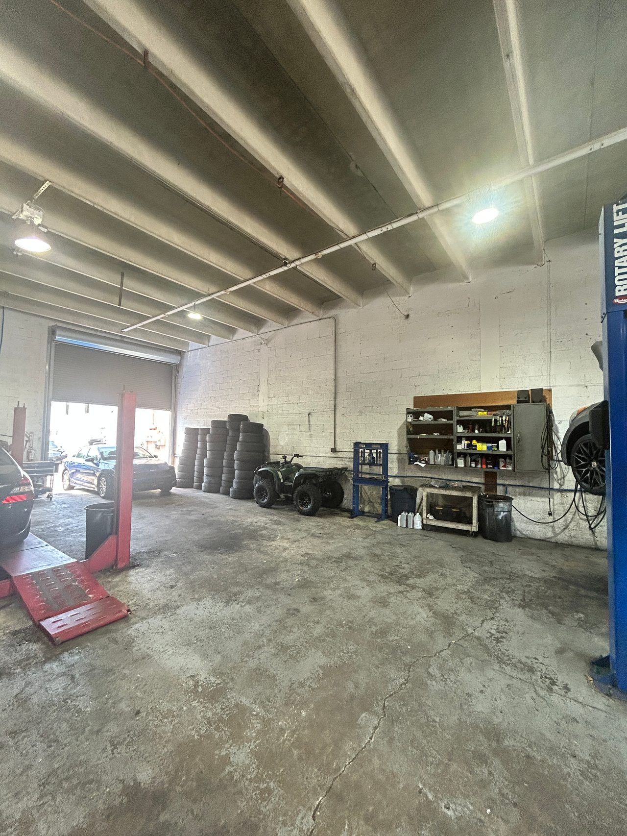 Tire inventory and service equipment inside Mac Tires in Pompano Beach