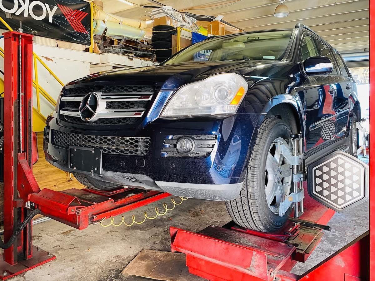 Mercedes-Benz SUV with wheel alignment targets at Mac Tires