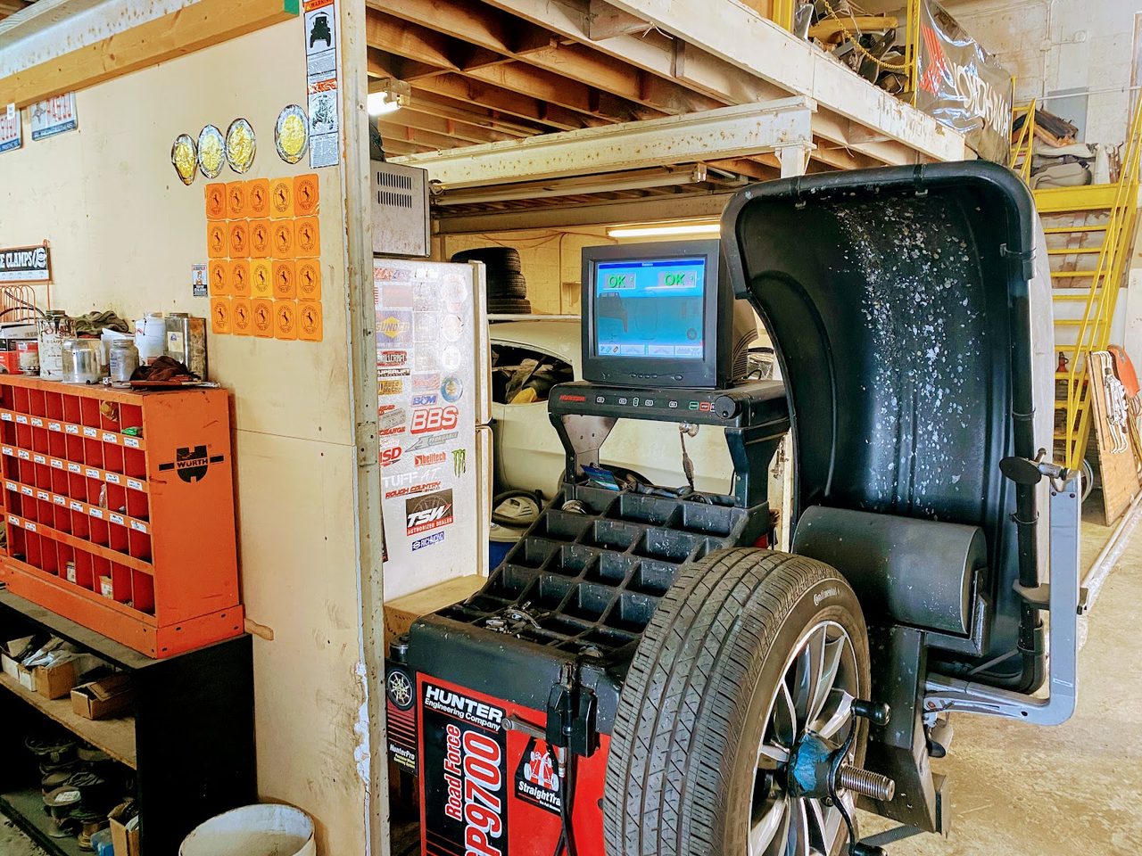 A wheel on the balancer at Mac Tires in Pompano Beach