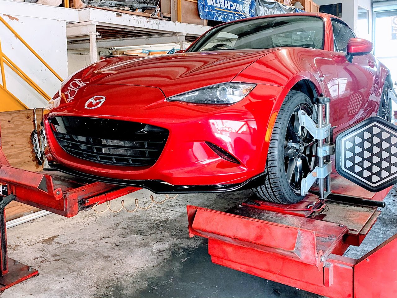 A Mazda MX-5 in for tires