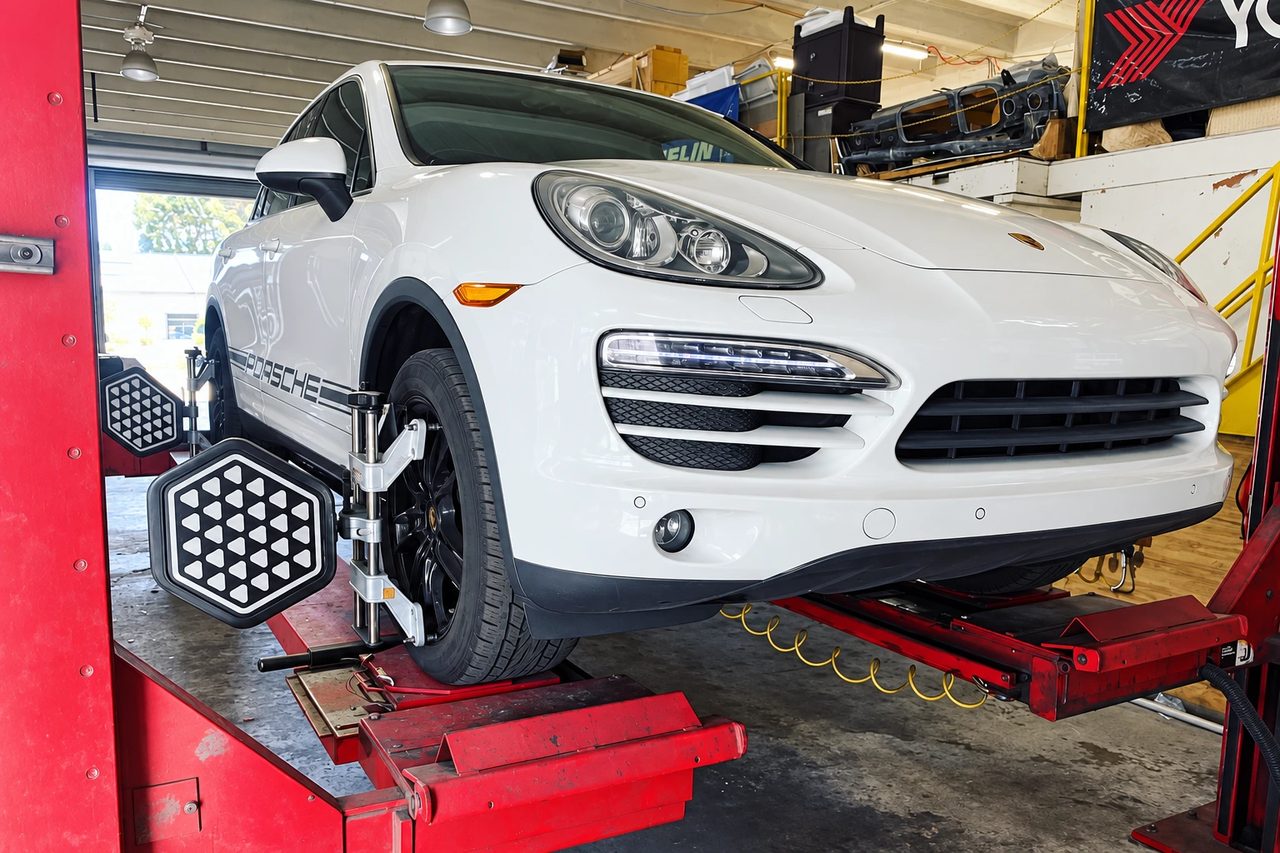 Porsche Cayenne on the alignment rack at Mac Tires in Pompano Beach