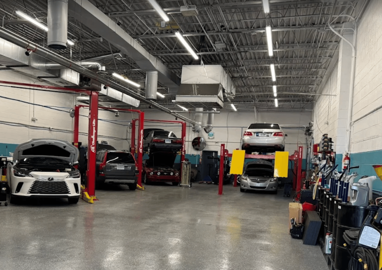 Cars on the lifts at John's Auto Care in Lorton