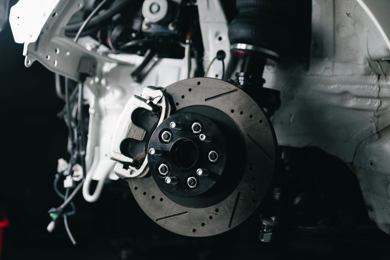 Exposed brake rotor and caliper with the wheel removed