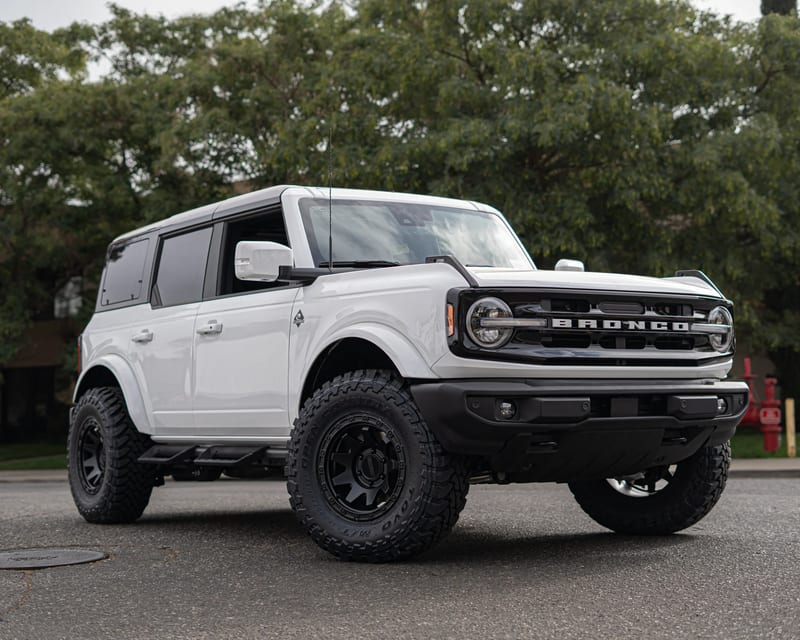 White Ford Bronco with black off-road wheels
