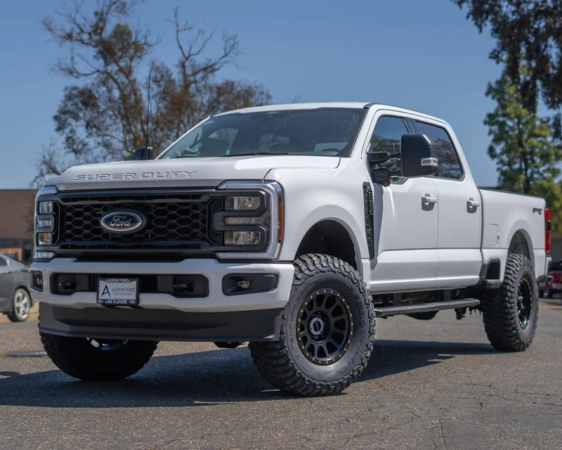 White Ford pickup outside Jeep Doctor