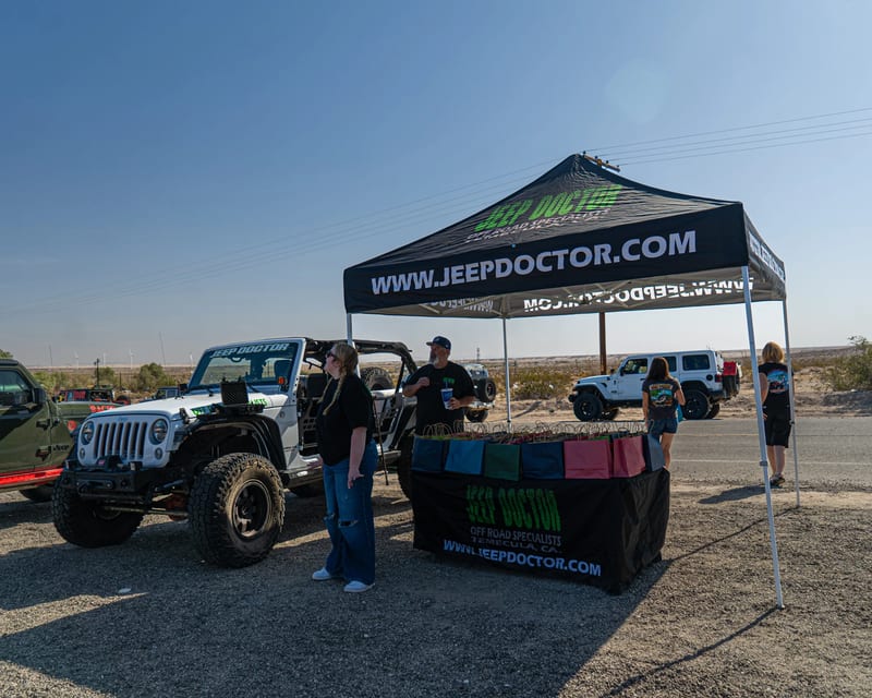 Jeep Doctor display tent and Jeeps at an outdoor event