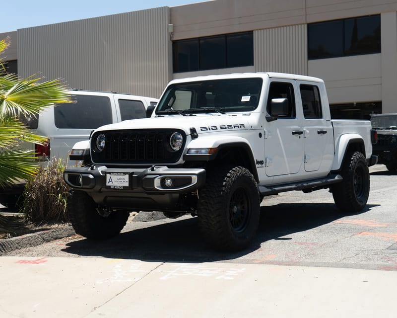 White Jeep Gladiator outside the shop